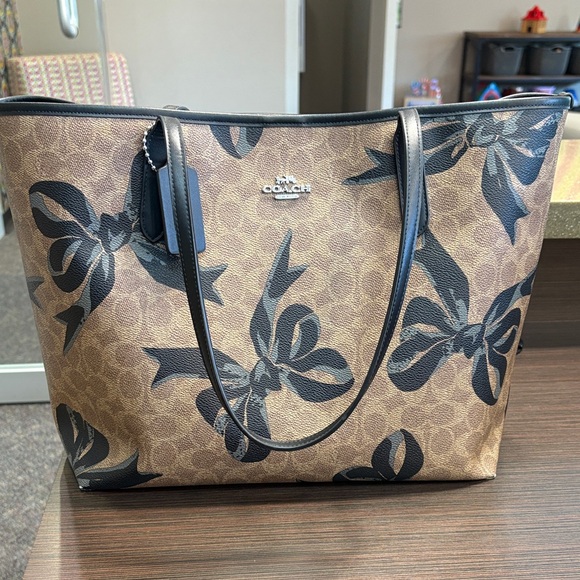 Coach Handbags - Coach Tan and Black Bow Print Tote
